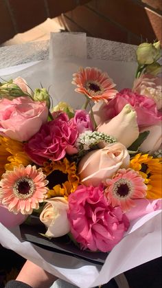 a bouquet of flowers sitting on top of a table