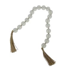 a white beaded necklace with tassels