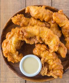 chicken wings and dipping sauce on a plate