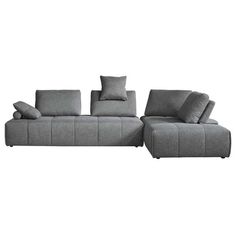 a gray sectional sofa with pillows on it