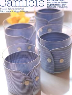 four blue cups sitting on top of a table