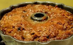 a bundt cake in a metal pan on top of a stove