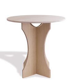 a round wooden table with an intricate design on the top and base, against a white background