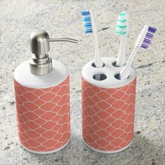 two toothbrush holders are sitting on the ground