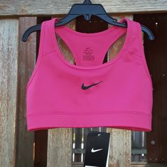 Nike Dri-Fit Sports Bra. Level: Medium Support Size: X-Small Condition: New With Tags Pink Fitted Activewear With Built-in Padding, Pink Activewear With Built-in Padding For Light Sports, Nike Moisture-wicking Sports Bra For Workout, Pink Sports Bra For Running, Athletic Fit, Pink Athletic Fit Sports Bra For Running, Sporty Snug Fit Activewear For Running, Pink Sports Bra For Light Sports, Sweat Resistant, Nike Sports Bra With Go-dry Technology, Nike Athletic Fit Sports Bra With Go-dry Technology