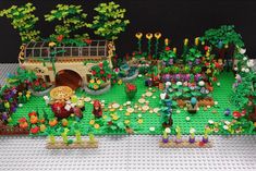 a lego garden with lots of plants and flowers