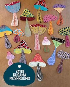 the colorful mushrooms are made out of paper and have different designs on each mushroom's sides