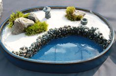 a blue bowl filled with rocks and water