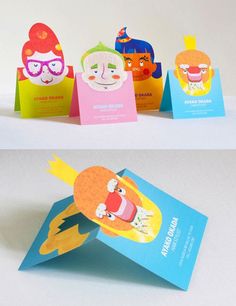 three different colored cards on top of each other, one with an image of a cartoon character