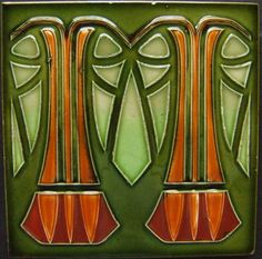 an art deco tile with orange and green designs