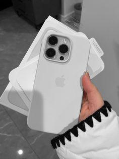 a person holding an iphone case in their left hand and showing it to the camera