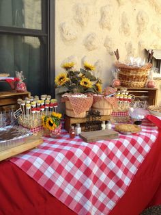 a table with sunflowers and other items on it