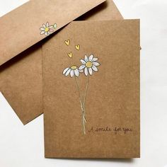 two greeting cards with daisies and hearts on them, one says i smile for you