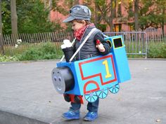 a little boy dressed up as thomas the train