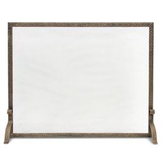 a white and gold fireplace screen