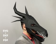 a man wearing a paper mask with a dragon head on it's face and the words svg + dxf + pdf