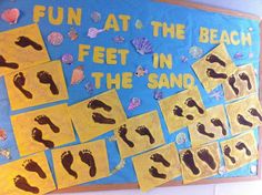 a bulletin board with feet in the sand on it