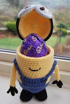 a crocheted toy with an egg in it