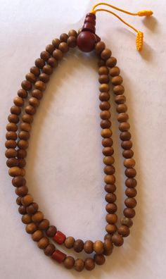 This small sandal wood mala has three traditional decoration beads and guru beads. It is from Nepal and nice and beautiful mala. it is 11 inches long mala. Holistic Wooden Beaded Bracelets For Meditation, Holistic Healing Mala With Wooden Beads, Handmade Wooden Beaded Bracelets For Meditation, Spiritual Wooden Beaded Bracelets, Holistic Wooden Beads Mala For Rituals, Holistic Wooden Mala For Rituals, Natural Wooden Beads Spiritual Bracelet, Traditional Wooden Beaded Bracelets For Meditation, Traditional Wooden Beads Necklace For Meditation