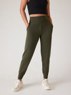 FOR: Restoration and rejuvenation FEEL: Super-soft Brushed Nirvana is extra cozy FAVE: A wide, ribbed waistband provides support and comfort Easy-access pockets to stash your essentials Relaxed with room to move Sits at the natural waist Inseam: Regular: 25.5". Olive Green Pants, Bra Dress, Girl Online, Green Pants, Swim Accessories, Athleta Pants, Bottom Clothes, Heather Black, Petite Size