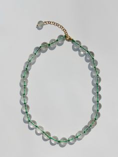 "This beautiful necklace is made from natural transparent round clear quartz crystal beads. Every single bead is hand knotted on an green cord. Find other colors of our CLARO necklace in 'Choker Necklace' section of our shop. The necklace is approximately 41 cm in length, (lenght varies slightly due to natural size differences in raw amethyst stone), necklace is adjustable and comes with a 5 cm (2 inch) extender. Beads: Clear Quartz Closure: 925 sterling silver 24kt gold plated lobster claw with Harry Styles Necklace, Choker Necklace Men, Harry Styles Jewelry, Amethyst Stone Necklace, Clear Quartz Necklace, Necklace Trendy, Trendy Necklace, Single Bead, Necklace Men