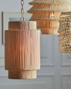 three chandeliers hanging from the ceiling in a room