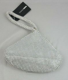 Fashion Nova Bianca Rhinestone Wristlet - Silver #21842C NEW  Phone or Smart Phone viewers .  As you view a listing. When you scroll down and see the caption “About this Item”  Please click the > to the right to view more details . COMES WITH A 30 DAY RETURN POLICY FREE SHIPPING WITH IN THE U.S. SELLER PAYS RETURN SHIPPING WITH IN THE 30 DAY RETURN PERIOD INTERNATIONAL SHIPPING THROUGH EBAY'S GLOBAL SHIPPING PROGRAM RETURN SHIPPING NOT PAID ON INTERNATIONAL ORDERS PROBLEMS WITH ORDER OR RETURNS Silver Wristlet For Evening, Elegant Silver Rectangular Wristlet, New Phone, New Phones, Smart Phone, Fashion Nova, Bags Handbags, Return Policy, Period