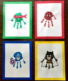 four handprints with different pictures of superheros and spider - man on them