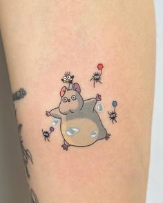 a small hippo tattoo on the right thigh