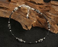 Black Silk Stone Gemstone Anklet, Black Anklets, Custom Anklets, Beaded Anklets by SWCreations #BeadAnklets #CrystalAnklets #CustomAnklets #HandmadeAnklets #GemstoneAnklet #BlackBeadedAnklets #BlackAnklets #GemstoneAnklets #BeadedAnklets #BlackAnklet Elegant Black Beaded Anklets, Handmade Adjustable Black Anklet, Black Anklets With Round Beads For Gift, Anklets Beaded, Gemstone Anklet, Black Anklet, Wedding Anklets, Handmade Anklets, Crystals Black