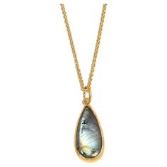 Tear-Drop Labradorite, 24K Gold Framed Pendant Necklace by Prehistoric Works of Istanbul, Turkey. These pendants look great alone or paired with other coin pendants or with miniature pendants. Measures:  11mm x 24mm (medium-sized pendant); chain options available. Gold Labradorite Pendant Jewelry, Elegant Labradorite Oval Pendant Necklace, Gold Teardrop Labradorite Necklace, Gold Labradorite Teardrop Pendant Jewelry, Labradorite Gemstone Oval Pendant Jewelry, Coin Pendant, Gold Frame, Istanbul, Labradorite