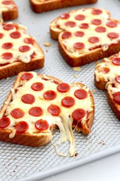 pepperoni pizza slices are on a baking sheet and ready to be baked in the oven