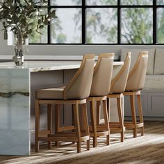 a set of four chairs sitting next to a counter