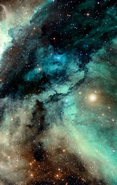 an image of the galactic sky with stars and clouds in blue, green and yellow colors