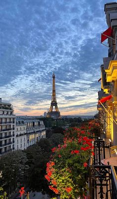 the eiffel tower towering over the city of paris, france at sunset or dawn