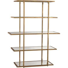 a gold shelf with glass shelves on it