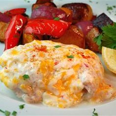 a white plate topped with meat and veggies