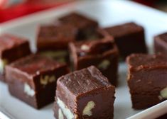 several pieces of chocolate cake on a white plate