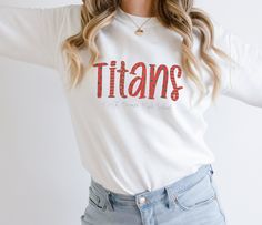 🔥 Elevate your game day style with this North Oconee Titans sweatshirt! 🔥 Get ready to show off your school spirit in the coziest and trendiest way possible. This sweatshirt is not just about comfort; it's a statement piece that will make you stand out from the crowd. 🎉 🏈 Designed for ultimate comfort and warmth, this sweatshirt is perfect for chilly fall evenings and crisp winter days. The classic North Oconee Titans logo proudly displayed on the front will let everyone know where your allegiance lies. 🦁 Crafted with high-quality materials, it's not just about looking great; it's about feeling great too! Whether you're cheering from the stands or snuggled up at home, this sweatshirt is your perfect companion. 🏟️ 🌟 Product Details: Material: Soft, cozy fabric for ultimate comfort De School Spirit Wear, Announcement Pregnancy, Retro Sweatshirts, Nurse Sweatshirt, Female Empowerment, Spirit Wear, Boho Fall, Mama Sweatshirt, Valentines Day Shirts