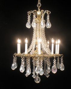 a chandelier with many candles in it