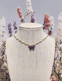 ROBYN – Olive Lynn Festival Butterfly Charm Necklaces, Purple Beaded Choker Jewelry, Purple Beaded Choker Necklace, Festival Butterfly Charm Necklace, Trendy Handmade Lavender Jewelry, Handmade Trendy Lavender Jewelry, Adjustable Trendy Purple Choker, Trendy White Butterfly Jewelry, Dainty White Jewelry For Festival