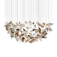 a chandelier with leaves hanging from it's sides and the light fixture is suspended