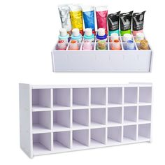 a white shelf filled with lots of different types of paint