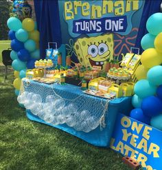 a birthday party with balloons and decorations for spongebob themed children's birthday