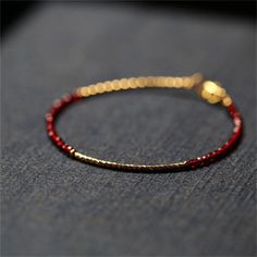 Material: Red Pointed Crystal 14K Gilded Color: Red Pointed Crystal 14K Gilded Bracelet Fashion Element: Water Ripple Style: Natural Dainty Red Round Jewelry, Handmade Red Ruby Bracelets, Gift Red 14k Gold Bracelet, Elegant 14k Gold Red Bracelet, Red Ruby Bracelets, Minimalist Red 14k Gold Bracelets, Minimalist 14k Gold Red Bracelets, Red Ruby Round Bracelets, Elegant Red Bangle Gold Bracelet