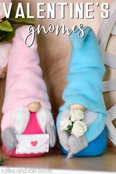 two gnomes sitting next to each other on a shelf with text overlay that says valentine's gnomes