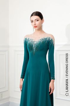 Materials: Crepe, beading, tulle Neckline: Round-neck Sleeve Style: Long sleeves Silhouette: A-line Built-in Bra: Yes