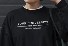 Custom College Sweatshirt - Fully customised to your needs. Show off your school spirit and add your school or department underneath, or put anything else you want on it! Choose from a variety of designs and colours. This listing is for embroidered Sweatshirts only - we do tees, hoodies (Extras: Hoodie upgrade (+6GBP totes and more so check our shop! We also do printed options - all available in our shop! Any special design requests, just let us know! Standard embroidery is across the chest (app College Logo Print Sweatshirt, Team Spirit Cotton Sweatshirt With University Logo, Collegiate Campus Sweatshirt With Text Print, Collegiate Sweatshirt With Text Print For Campus, Collegiate Text Print Campus Sweatshirt, Cotton Team Spirit Sweatshirt With University Logo, Cotton University Logo Sweatshirt For Team Spirit, Collegiate Style Sweatshirt With Text Print For Campus, University Logo Cotton Sweatshirt