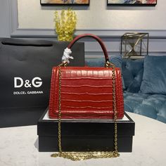 Description D.G Small Devotion Bag Red For Women 7.5in/19cm DG Rep 1:1 Size: 19 x 13 x 4.5 cm / 7.5 x 5.1 x 1.7 inches (Length x Width x Height) Top handle and detachable shoulder strap Front flap with bejeweled branded heart hand-tooled from a metal alloy with pearl inlay Concealed magnetic fastening and customized heart Interior with flat pocket Item comes with its own special dust bag and packaging Includes box, dust bag. This product is of the best quality.