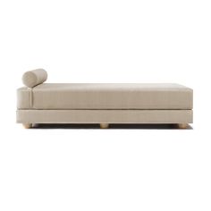 a beige couch with wooden legs on a white background